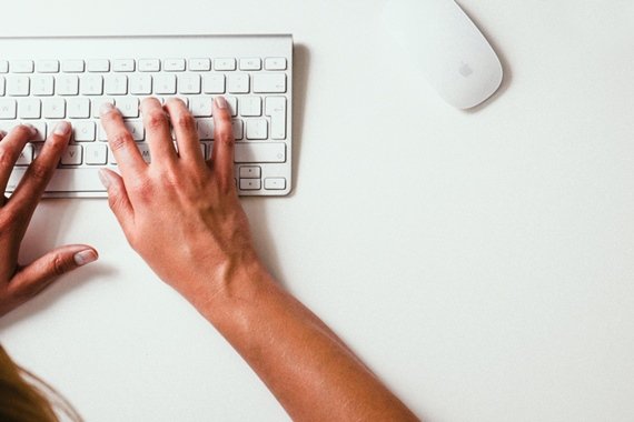 Office desk, typing on a keyboard