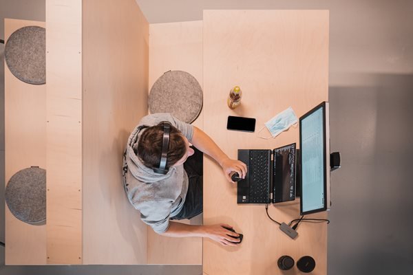 A man working in an isolated workspace