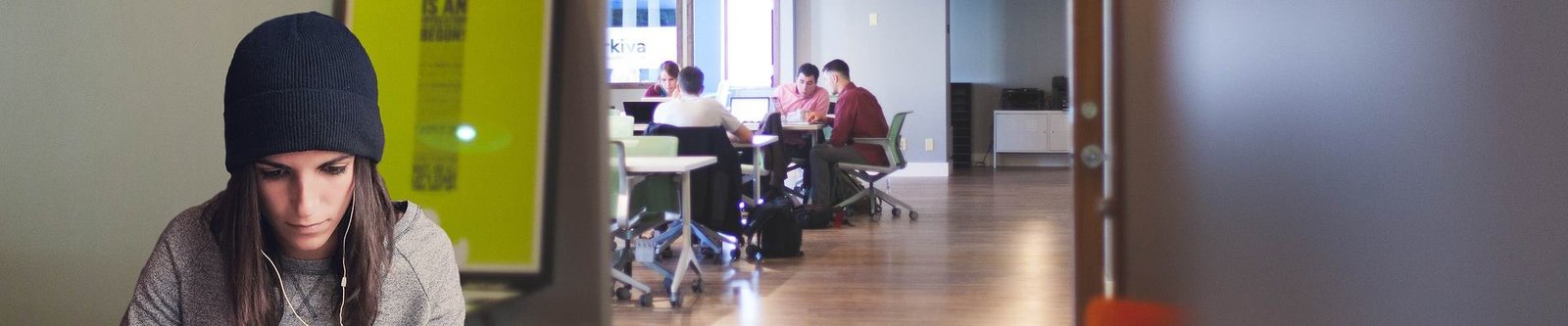 Woman in coworking, focused on her work