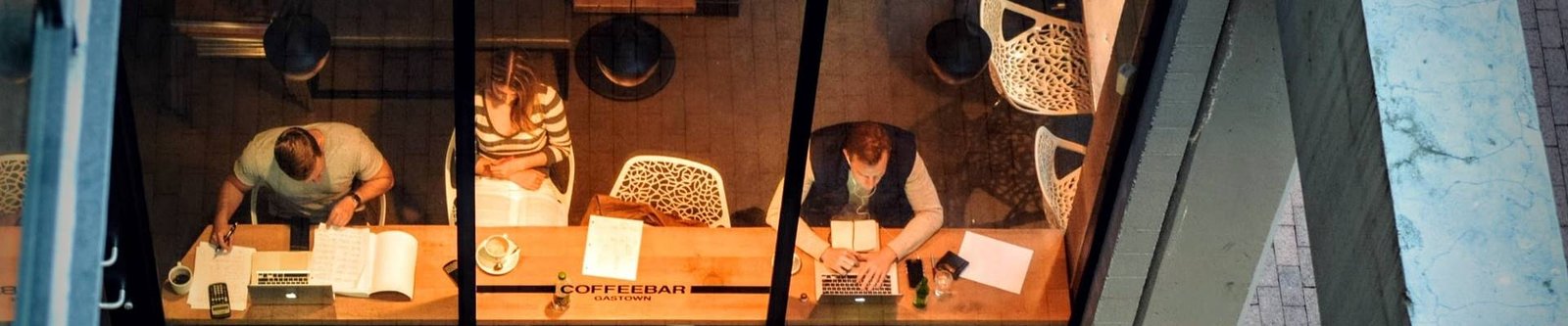 A man sitting and working on his laptop